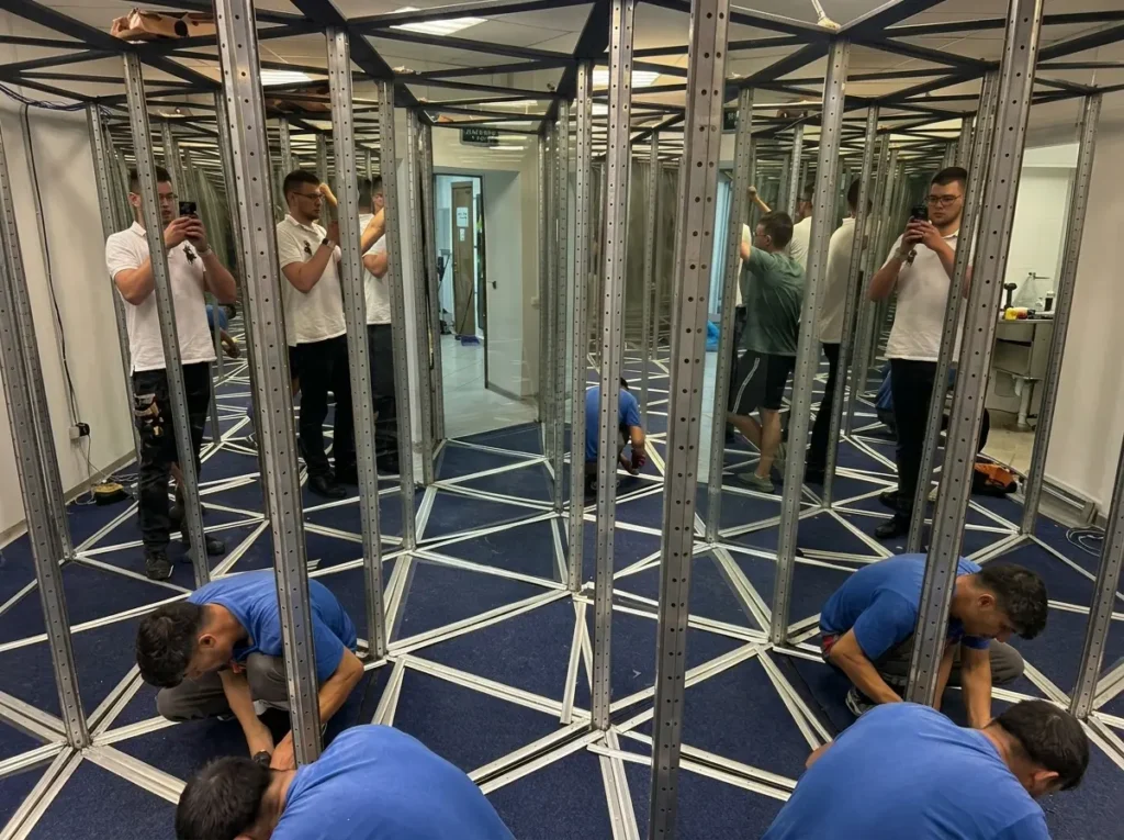 Commercial mirror maze with mirrored panels and themed lighting
